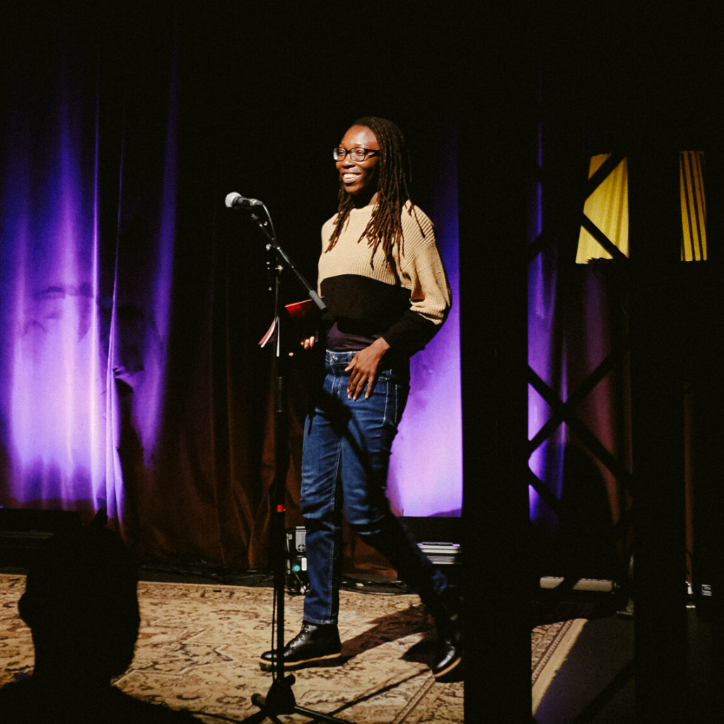 Nijkitta Adjirakor reads from her creative nonfiction piece "Bodies of Loss" at the SAND 23 launch in Berlin on 5 November 2022